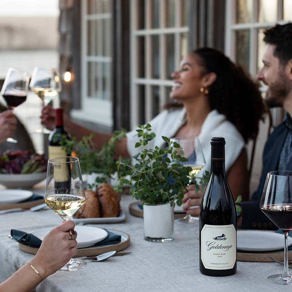 Wine bottles of Duckhorn, Paraduxx, Goldeneye, Migration, Calera on an outdoor table
