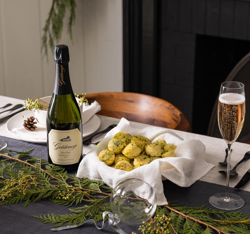 Goldeneye Sparkling wine on a table with Egg Soufflé Bites