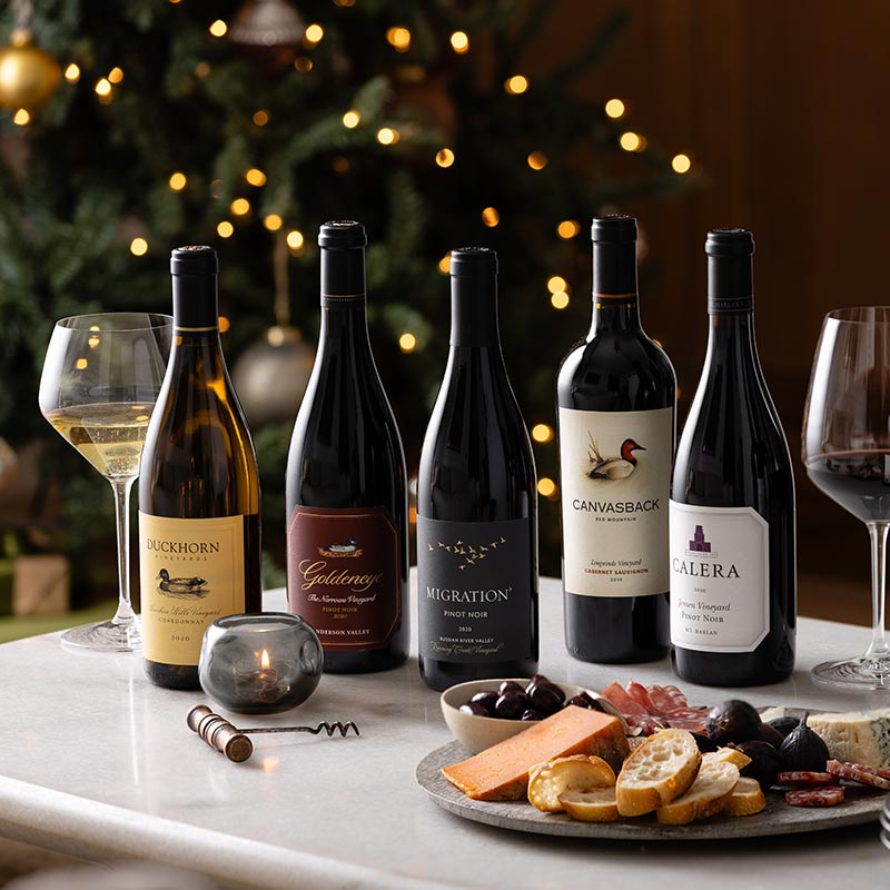 Five bottles of Duckhorn Portfolio on a holiday table