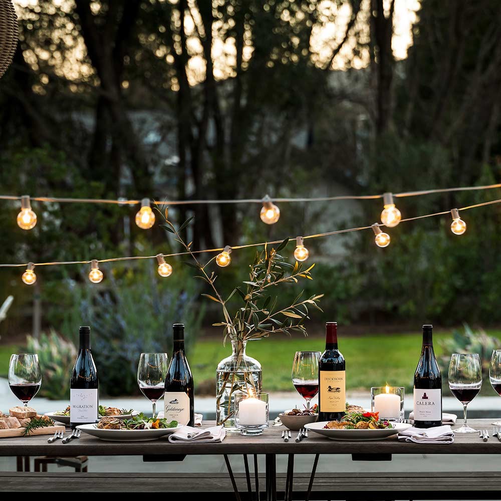 Outdoor dining table with wines from The Duckhorn Portfolio
