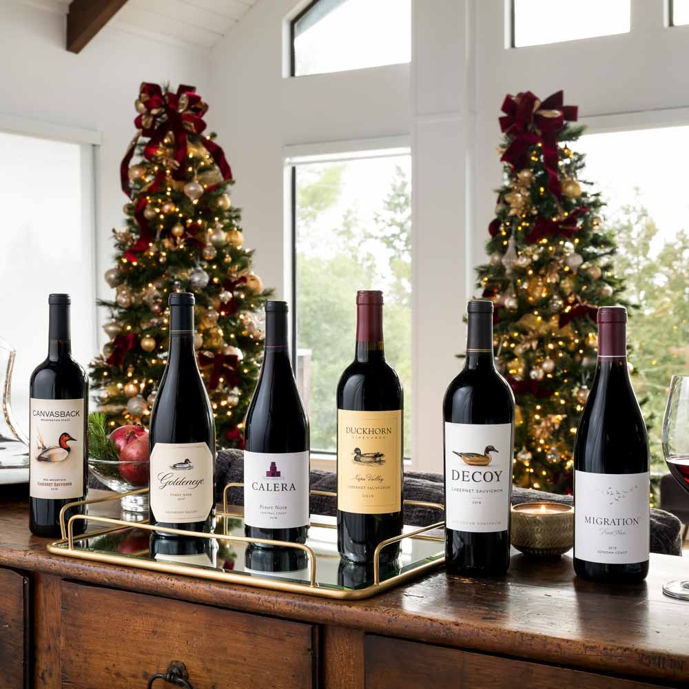 The Duckhorn Portfolio wines in a living room in front of two Christmas trees