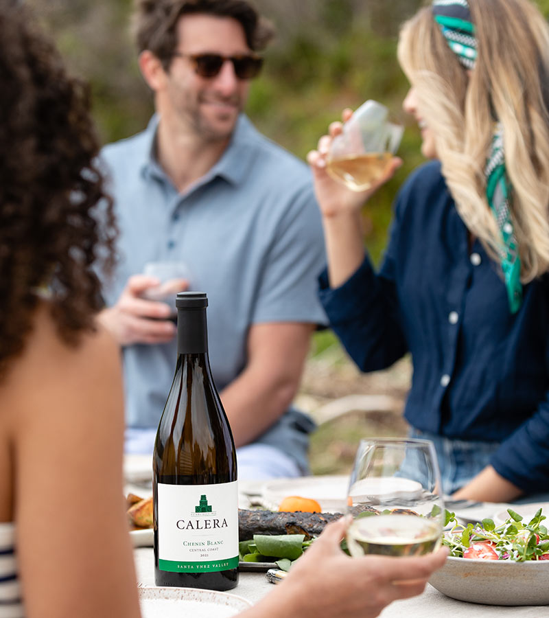 Friends eating at table with Calera Chenin Blanc
