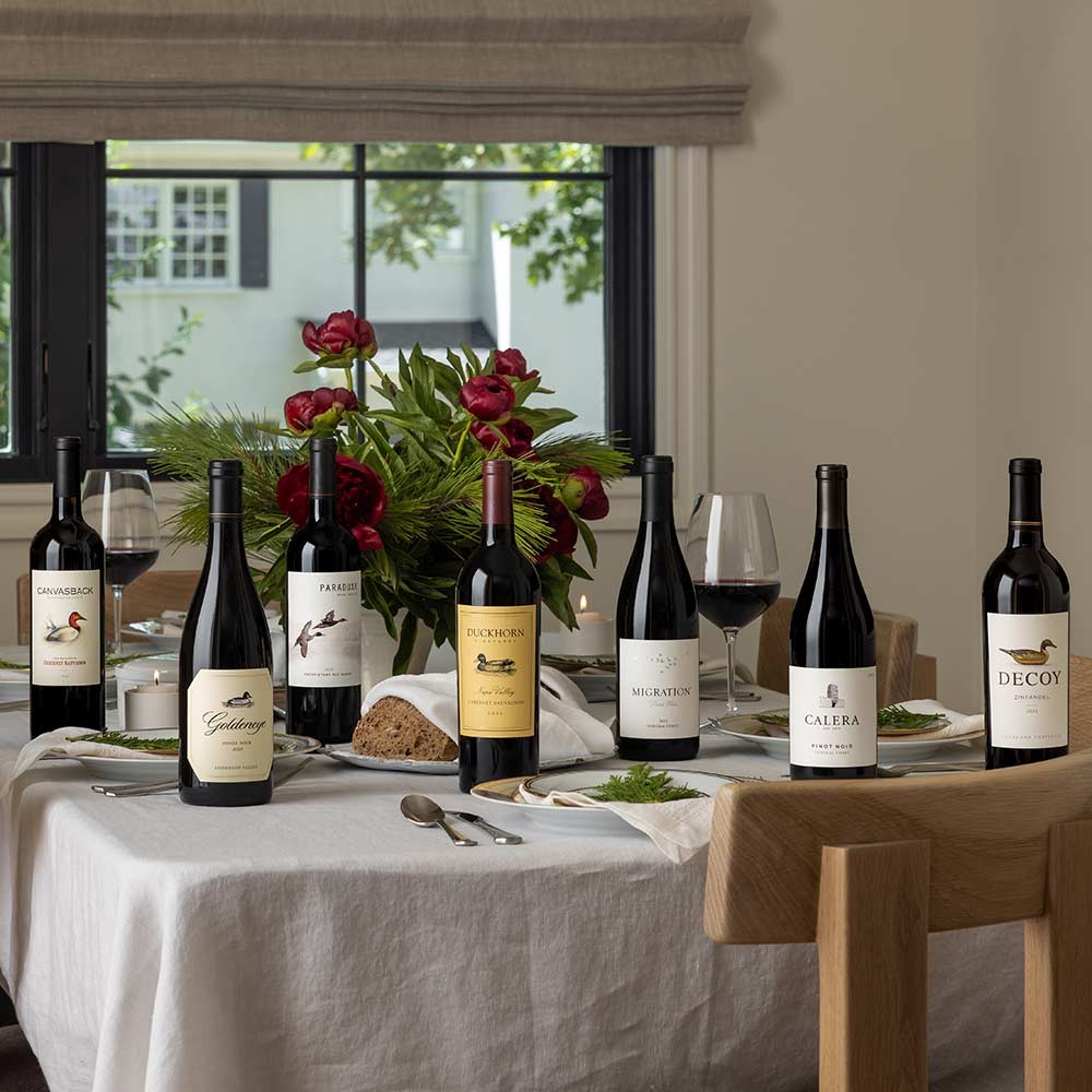 Setting up dining table with wines from The Duckhorn Portfolio