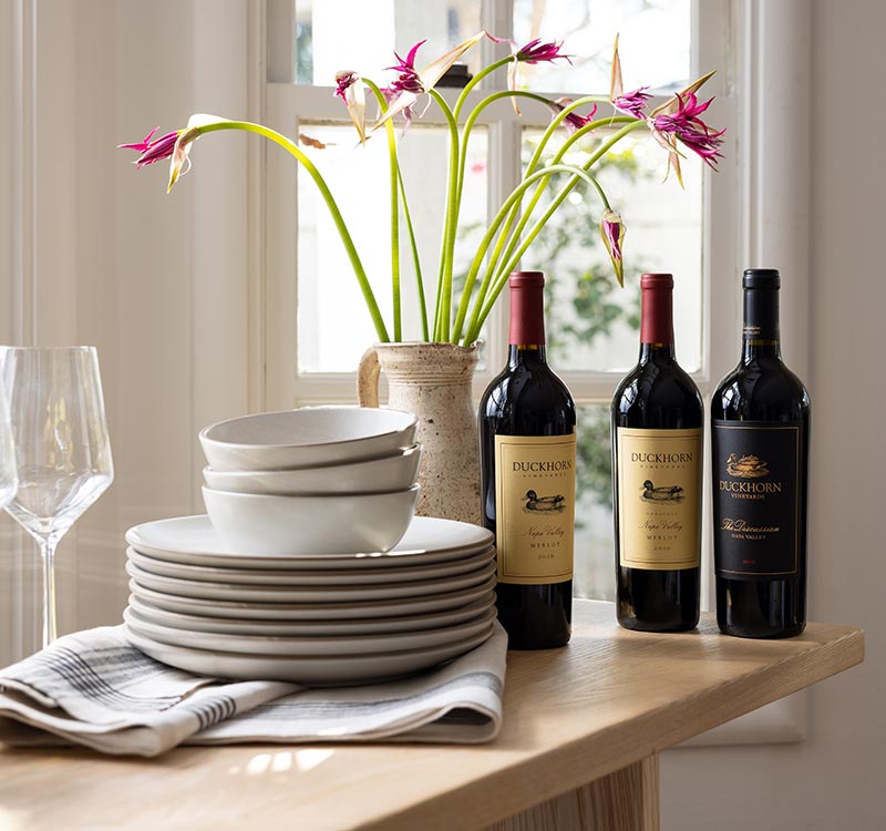 Three bottles of Duckhorn Vineyard wines on a table