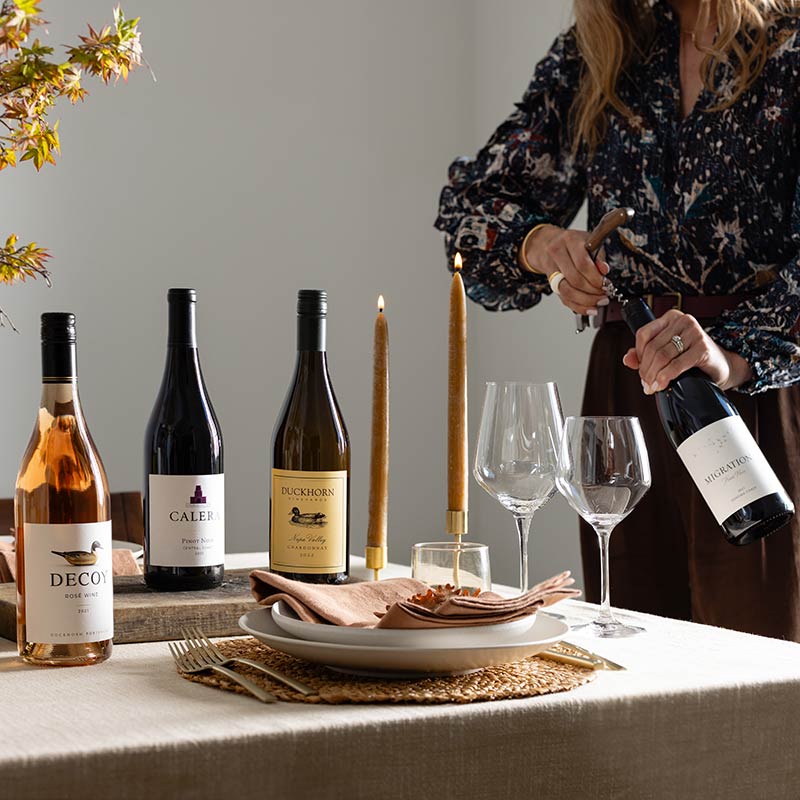Four Duckhorn Portfolio wines on a fall table
