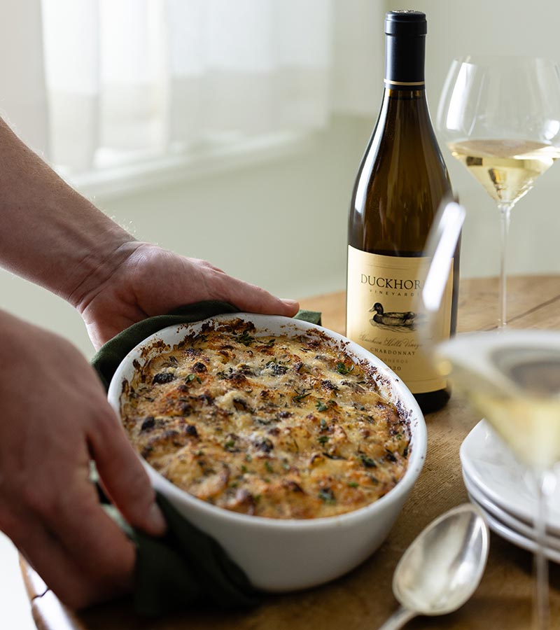 Duckhorn Chardonnay on a table with potatoes