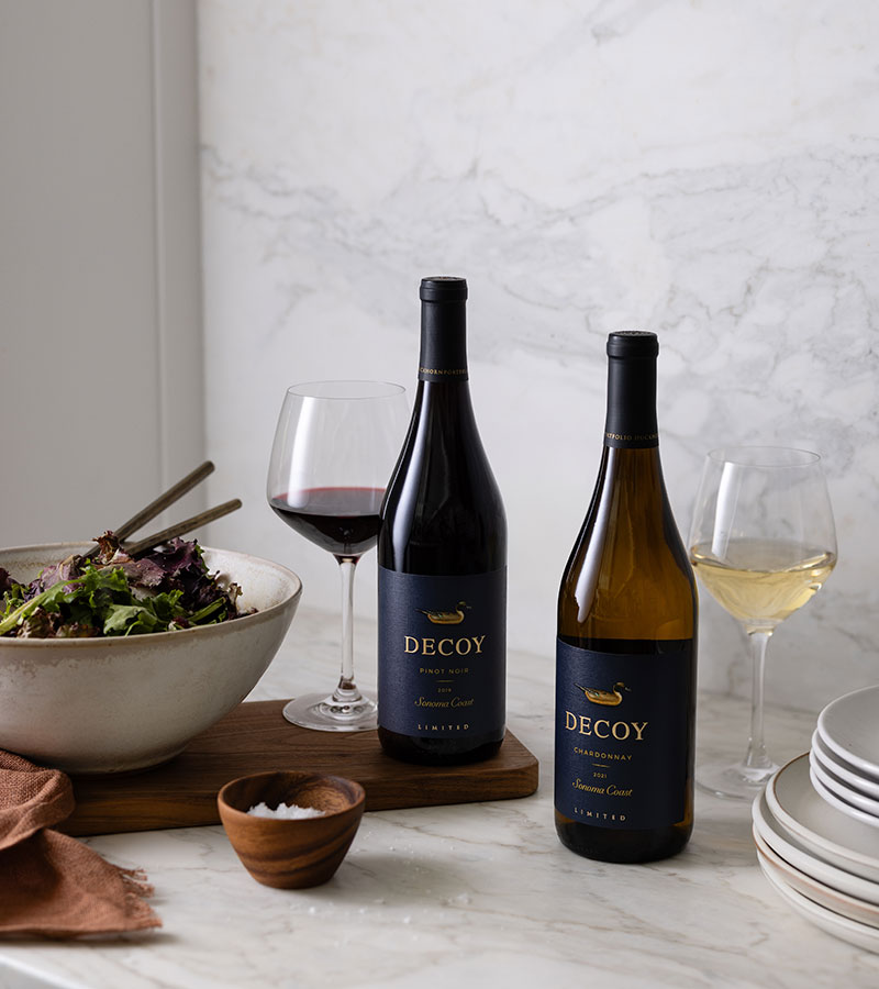 Decoy wines on a kitchen counter with a salad