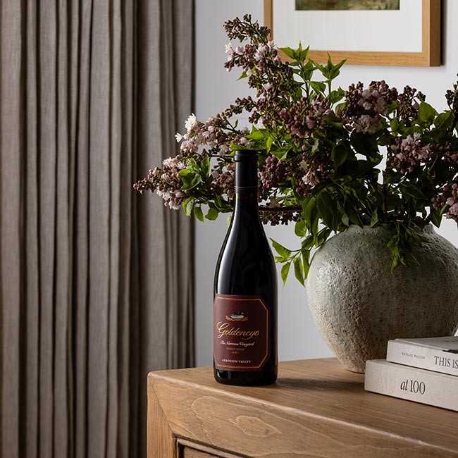 Goldeneye Pinot on a table