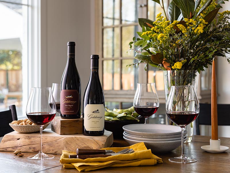 Two bottles of Goldeneye wines on a spring table