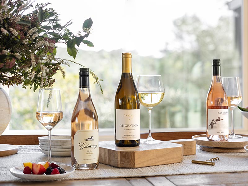 Three Bottles of The Duckhorn Portfolio wines on a table with flowers