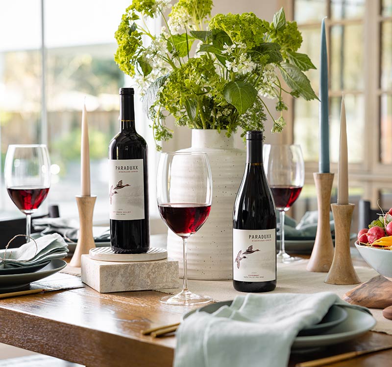 Two bottles of Paraduxx wines on a table