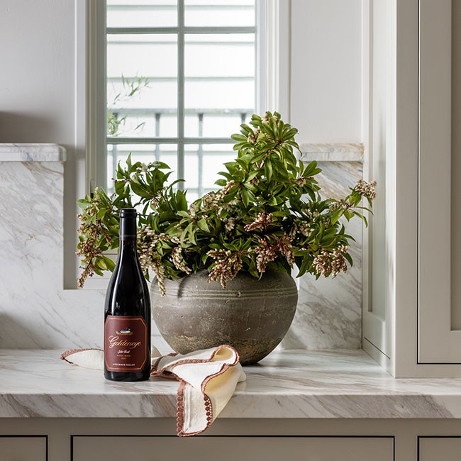 Goldeneye Pinot on a table