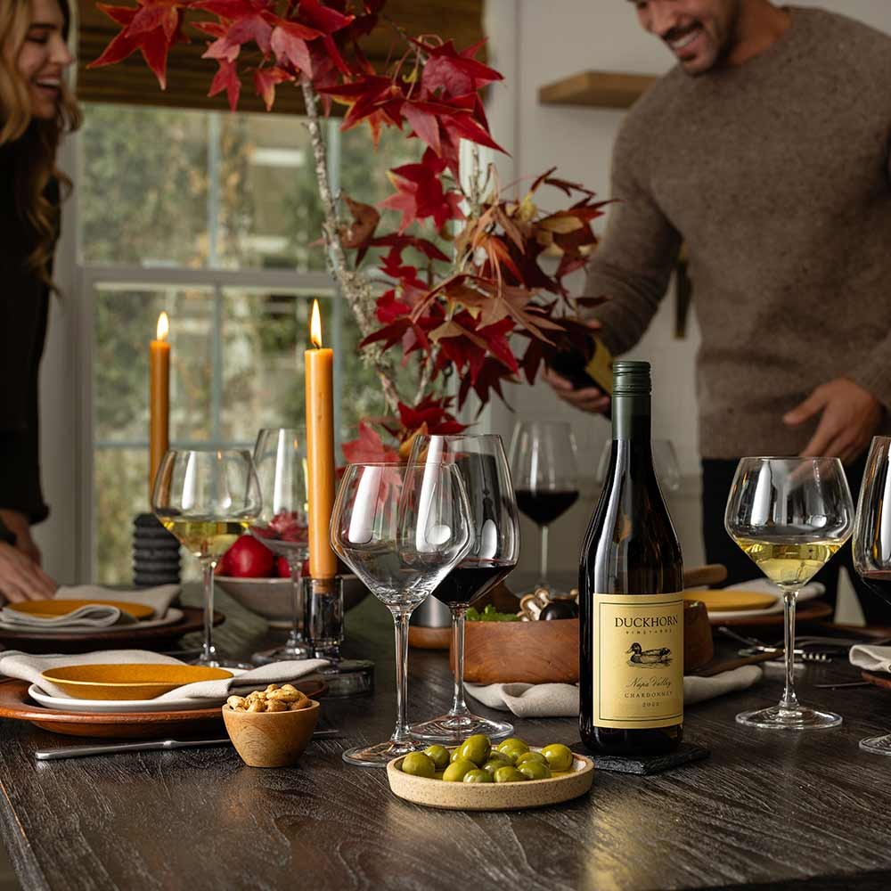 Setting up dining table with wines from The Duckhorn Portfolio