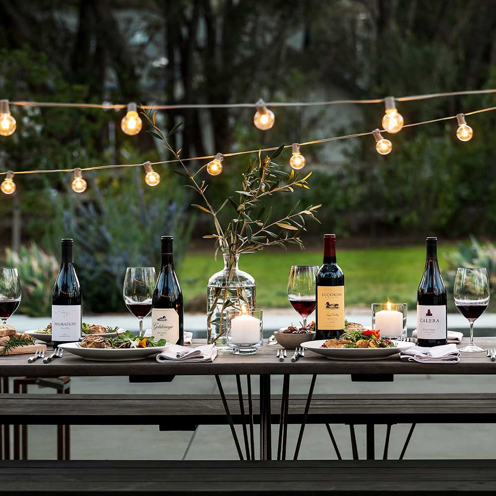 Duckhorn Portfolio wines on an outdoor dining table