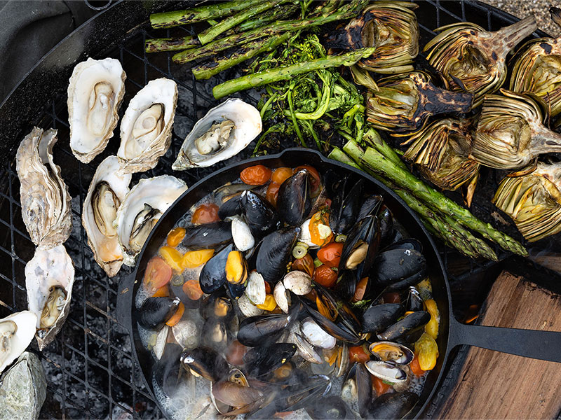Seafood and vegetables on an open grill