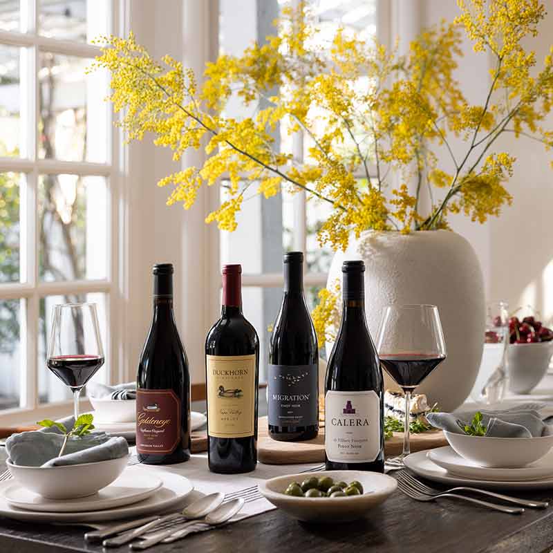 Four bottles of Duckhorn Portfolio on table